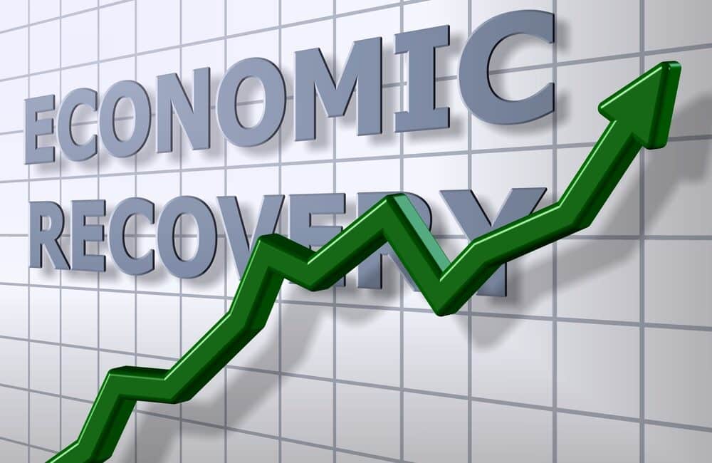 A,Green,Chart,Arrow,In,Front,Of,An,Economic,Recovery